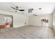 Spacious living room with tile flooring, ceiling fan, and views to other rooms at 105 John Anderson Dr, Ormond Beach, FL 32176