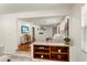 Bright and airy living room with hardwood floors, fireplace, and open layout with stylish decor and shelving at 105 John Anderson Dr, Ormond Beach, FL 32176