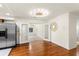 Open living area showcasing wood floors, modern lighting, and seamless transition to other rooms at 105 John Anderson Dr, Ormond Beach, FL 32176