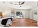 Bright main bedroom featuring wood floors, a fireplace, and access to the backyard patio at 105 John Anderson Dr, Ormond Beach, FL 32176