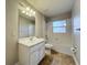 Bathroom with a single sink vanity and tub shower at 117 Burns Ave, Longwood, FL 32750