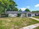 Charming single-story home featuring well-maintained landscaping and an attached garage at 117 Burns Ave, Longwood, FL 32750