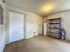 Garage features a single lightbulb, water heater, and storage shelves at 117 Burns Ave, Longwood, FL 32750