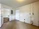 Garage featuring an entry door, utility access and door to the interior of the home at 117 Burns Ave, Longwood, FL 32750