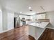 Bright, modern kitchen with stainless steel appliances and an island with a breakfast bar at 117 Burns Ave, Longwood, FL 32750