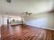 Spacious living room flows into the modern kitchen with stainless steel appliances at 117 Burns Ave, Longwood, FL 32750