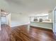 Bright living space connecting to a well-appointed kitchen with granite countertops at 117 Burns Ave, Longwood, FL 32750