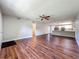 Open-concept living space with hardwood floors, neutral walls, and plenty of natural light at 117 Burns Ave, Longwood, FL 32750