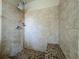 Tiled walk-in shower featuring a bench and modern shower head fixtures at 117 Burns Ave, Longwood, FL 32750
