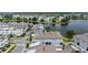 Primary-planned community with modern townhomes set along a serene lake and thoughtfully designed landscaping at 12468 Koshiba Aly, Orlando, FL 32827