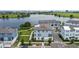 Lakeside community featuring modern townhomes with inviting landscaping and scenic water views at 12468 Koshiba Aly, Orlando, FL 32827