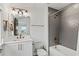Nicely designed bathroom with tub and shower combination, grey tile, and modern vanity at 12468 Koshiba Aly, Orlando, FL 32827