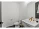 Contemporary bathroom with a pedestal sink and modern gold faucet at 12468 Koshiba Aly, Orlando, FL 32827