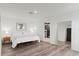 Clean bedroom with a bed, mirrored door, and open doorway to bathroom at 12468 Koshiba Aly, Orlando, FL 32827