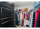 Spacious walk-in closet with ample hanging space and shelving for organized storage solutions at 12468 Koshiba Aly, Orlando, FL 32827
