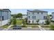 Modern townhomes near a lake offer scenic views and community appeal in a desirable location at 12468 Koshiba Aly, Orlando, FL 32827