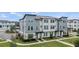 Charming townhomes showcasing modern architecture, landscaped yards, and inviting curb appeal in a desirable neighborhood at 12468 Koshiba Aly, Orlando, FL 32827