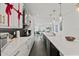 Bright kitchen with black backsplash, white cabinets, quartz countertops, and stainless steel appliances at 12468 Koshiba Aly, Orlando, FL 32827