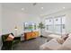 Well lit living room with modern furniture and decor at 12468 Koshiba Aly, Orlando, FL 32827