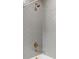A close up of the shower with gold accents and a modern waterfall shower head at 12468 Koshiba Aly, Orlando, FL 32827