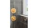 Close up of shower with bronze fixtures, grey tiled walls, and a sleek design at 12468 Koshiba Aly, Orlando, FL 32827
