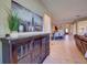 Inviting hallway with stylish decor and views leading to the open kitchen and living areas at 12832 Sawgrass Pine Cir, Orlando, FL 32824