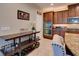 Kitchen with stainless steel appliances, dark wood cabinets, wine rack, and stylish breakfast bar seating at 12832 Sawgrass Pine Cir, Orlando, FL 32824