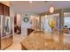Open kitchen layout featuring granite countertops, stainless steel appliances, and breakfast bar seating at the island at 12832 Sawgrass Pine Cir, Orlando, FL 32824