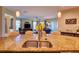Open kitchen with granite countertops, stainless steel sink, pendant lights and views of the living area at 12832 Sawgrass Pine Cir, Orlando, FL 32824