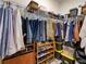 Spacious walk-in closet features wood flooring and custom shelving for organized storage at 12832 Sawgrass Pine Cir, Orlando, FL 32824