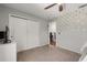 Cozy bedroom with a closet, neutral walls, and carpeted floor at 14524 Huntingfield Dr, Orlando, FL 32824