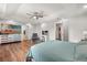Large bedroom with hardwood floors, a TV, and a vanity at 14524 Huntingfield Dr, Orlando, FL 32824