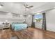 Large bedroom with hardwood floors and a large window with outside views at 14524 Huntingfield Dr, Orlando, FL 32824