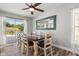 Bright dining room featuring a wooden table, seating for six, and sliding glass doors to the outside patio at 14524 Huntingfield Dr, Orlando, FL 32824