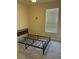 Bedroom with carpeted floors and bed frame, offering a simple design at 152 Glendale Ct, Kissimmee, FL 34759