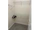 Walk-in closet features metal shelving for plenty of storage in a carpeted space at 152 Glendale Ct, Kissimmee, FL 34759