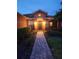 Charming front entrance with brick walkway and well-maintained landscaping provides curb appeal at 152 Glendale Ct, Kissimmee, FL 34759