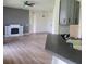 Open-concept living room with modern fireplace, seamless transition to the kitchen area at 152 Glendale Ct, Kissimmee, FL 34759