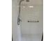 Shower with grab bar and white tiled walls at 152 Glendale Ct, Kissimmee, FL 34759
