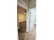 Bathroom featuring wood-look flooring and a walk-in shower with frosted glass door at 1588 Diamond Loop Drive, Kissimmee, FL 34744