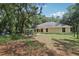Spacious backyard with mature trees, a pond, and lush greenery at 15888 Ne 152Nd Ave, Fort Mc Coy, FL 32134