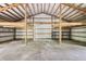 Expansive barn featuring wooden beam construction and a concrete floor that offers versatile space at 15888 Ne 152Nd Ave, Fort Mc Coy, FL 32134