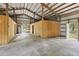 Spacious barn featuring a metal roof, concrete floor, and wooden support beams provides versatile space at 15888 Ne 152Nd Ave, Fort Mc Coy, FL 32134