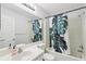 Bright bathroom with a shower/tub combo and modern fixtures at 15888 Ne 152Nd Ave, Fort Mc Coy, FL 32134
