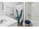 Bathroom boasts a double sink vanity and shower with a decorative curtain at 15888 Ne 152Nd Ave, Fort Mc Coy, FL 32134