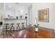 Stylish dining area with counter seating and view of kitchen appliances and vaulted ceiling at 15888 Ne 152Nd Ave, Fort Mc Coy, FL 32134