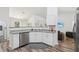 Well-lit kitchen featuring stainless steel appliances, granite countertops, and wood flooring at 15888 Ne 152Nd Ave, Fort Mc Coy, FL 32134