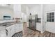Modern kitchen showcasing stainless steel appliances, light countertops, and ample cabinet space at 15888 Ne 152Nd Ave, Fort Mc Coy, FL 32134
