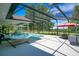 Backyard pool with outdoor seating, umbrella, grill, and a view at 17927 E Apshawa Rd, Minneola, FL 34715