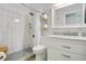 Bathroom with a modern tile shower, vanity with sink, and modern fixtures at 17927 E Apshawa Rd, Minneola, FL 34715